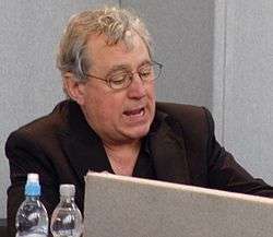 Jones seated before a laptop